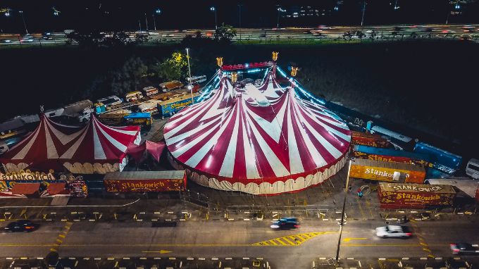 a circus tent with lights at night